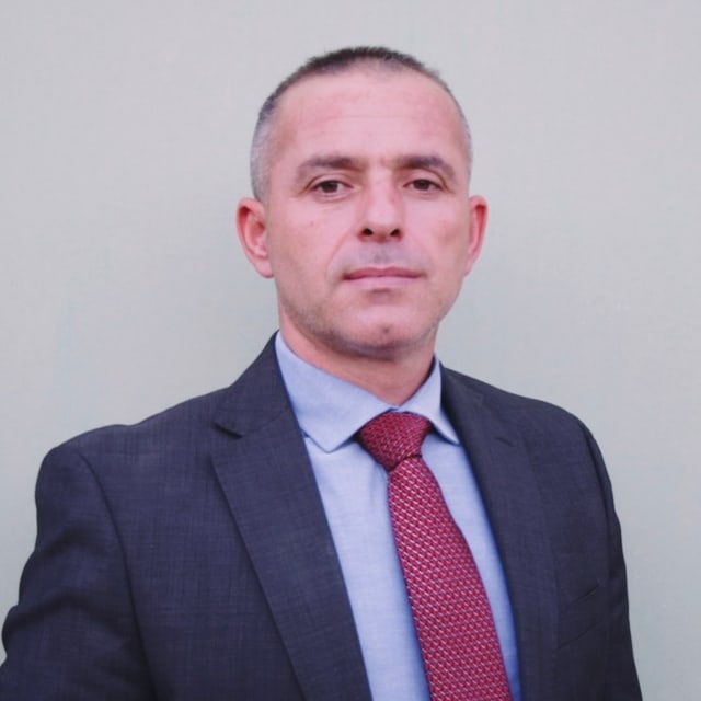 Niko Xhaholli — 